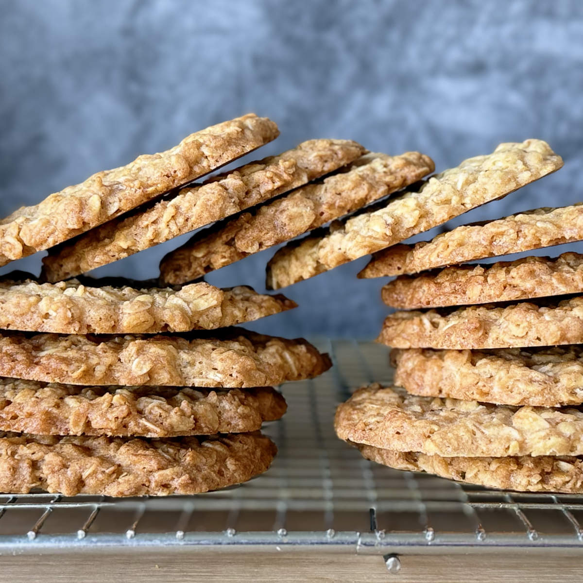 Crunchy oat biscuits on a rack with a crisp texture.