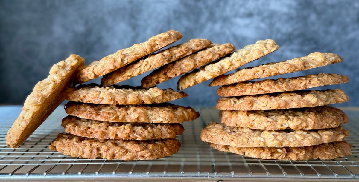 Crunchy oat biscuits in a stack on a cooling rack.