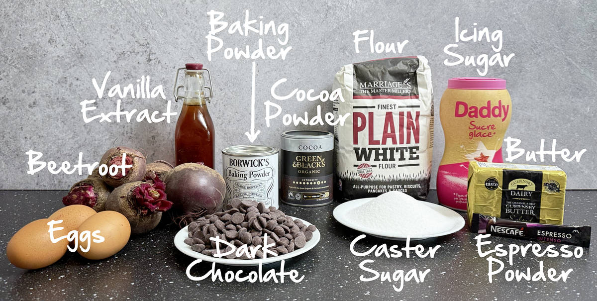 Eggs, fresh beetroot, vanilla extract, baking powder, cocoa powder, plain flour, icing sugar, butter, espresso powder, sugar and dark chocolate on a worktop.